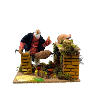 Man at the rotating spit in motion - 10 cm figurine