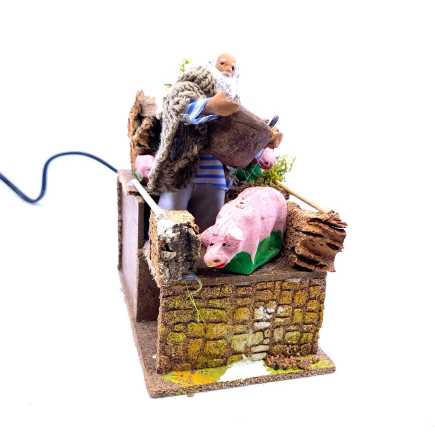 Pig breeder 8/9 cm in motion 10x15x15 cm