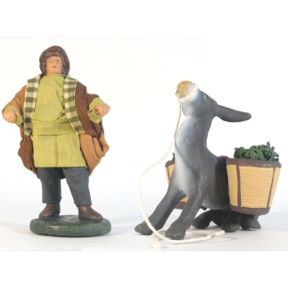 Young woman with a dressed terracotta donkey