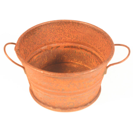 Large rusty metal basin