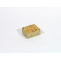 Small straw crate with light-colored seeds/clams/lentils