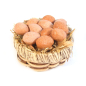 Round basket with eggs